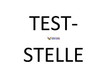 Weißer Hintergund. Große schwarze Schrift: Teststelle