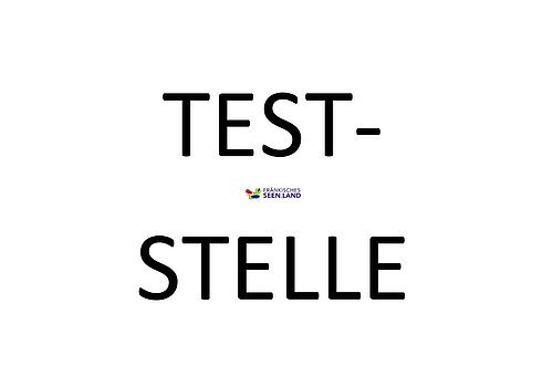 Weißer Hintergund. Große schwarze Schrift: Teststelle